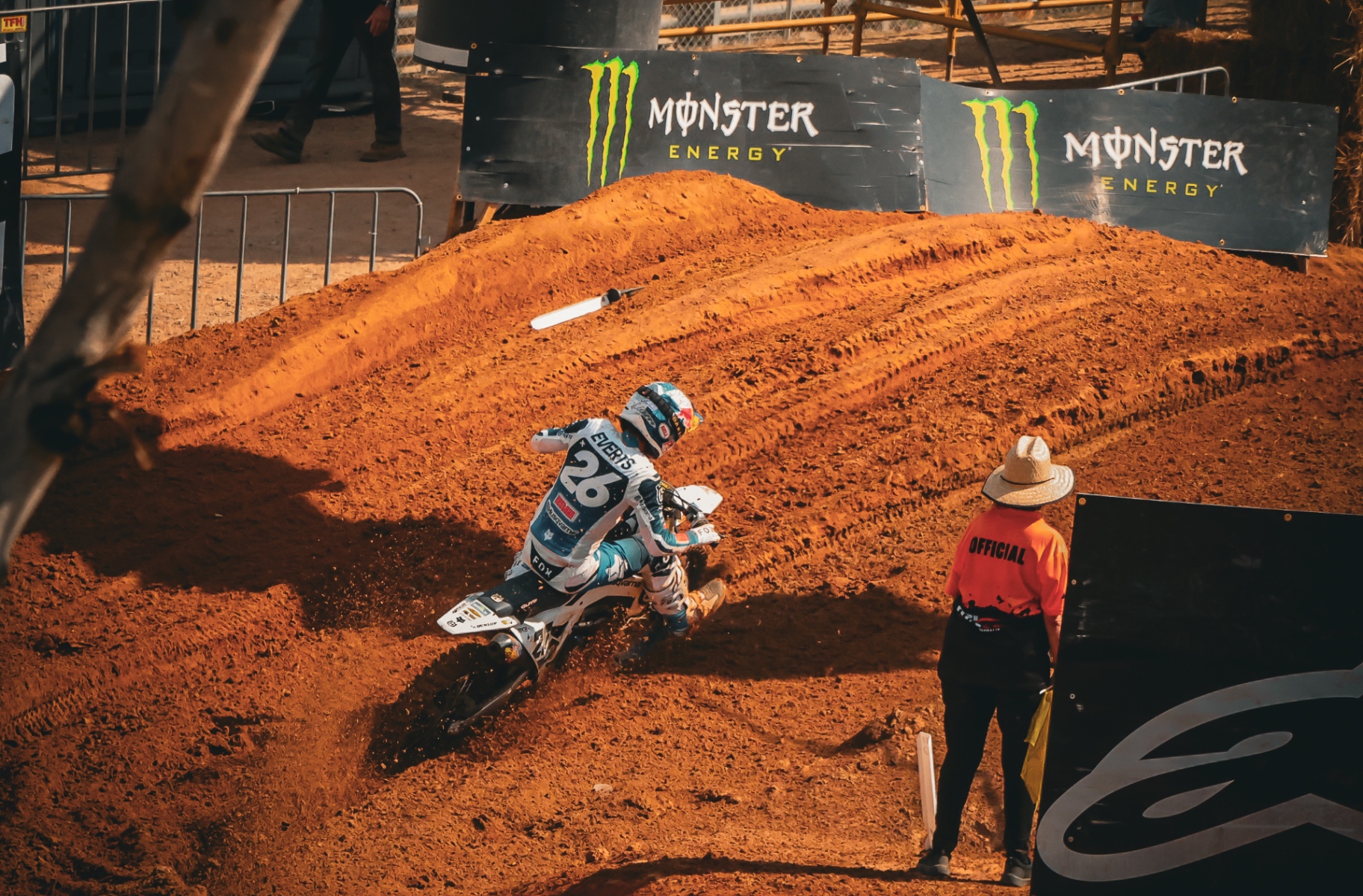 Motocross rider flying past Monster Energy flame cannons